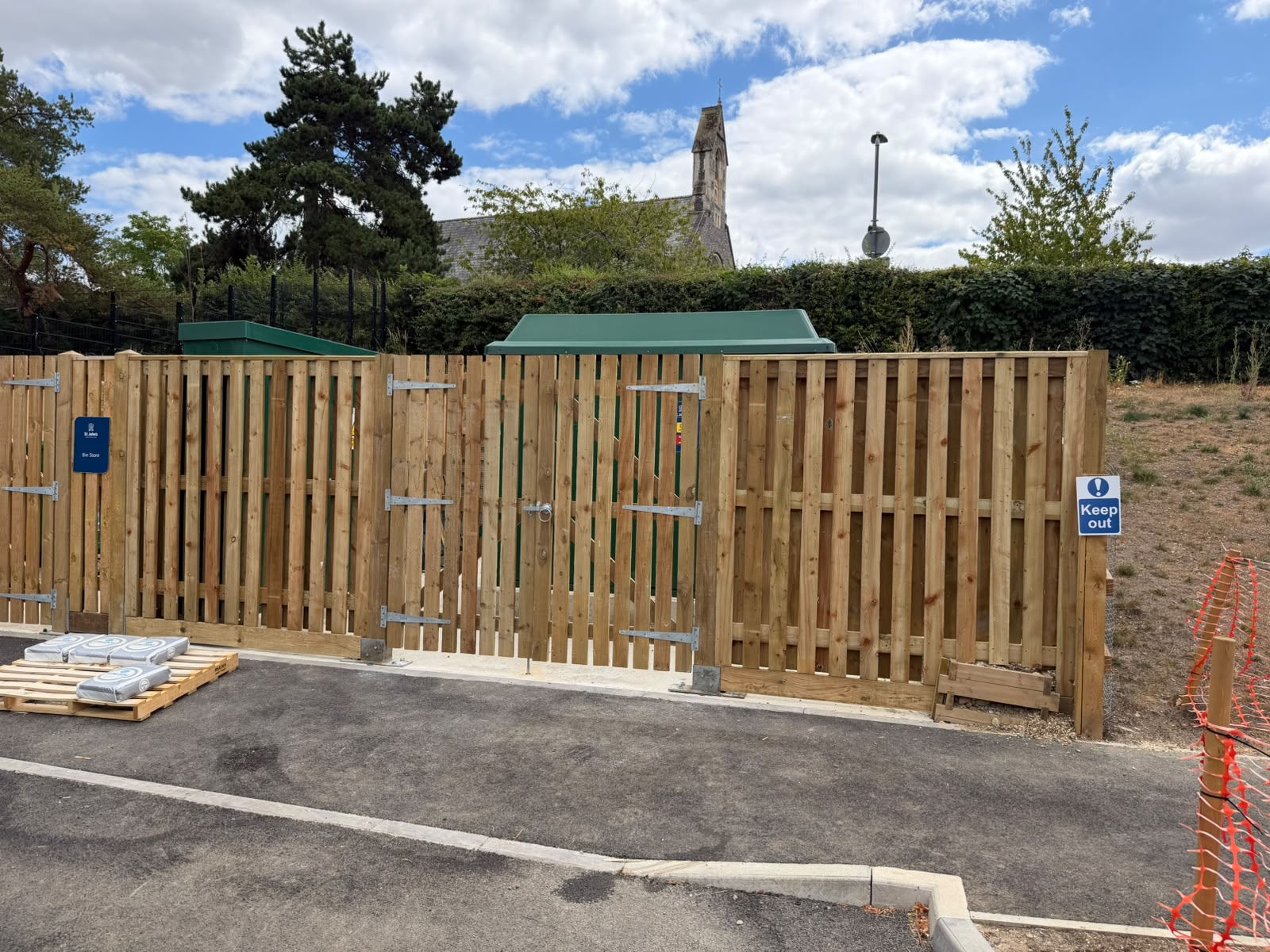Timber picket bin store with lockable double gates