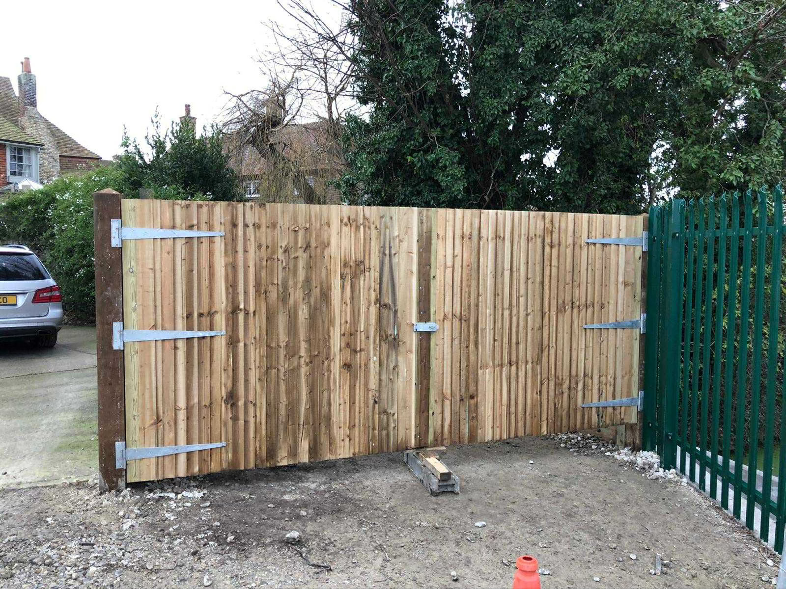 A pair of timber gates with galvanised hinges