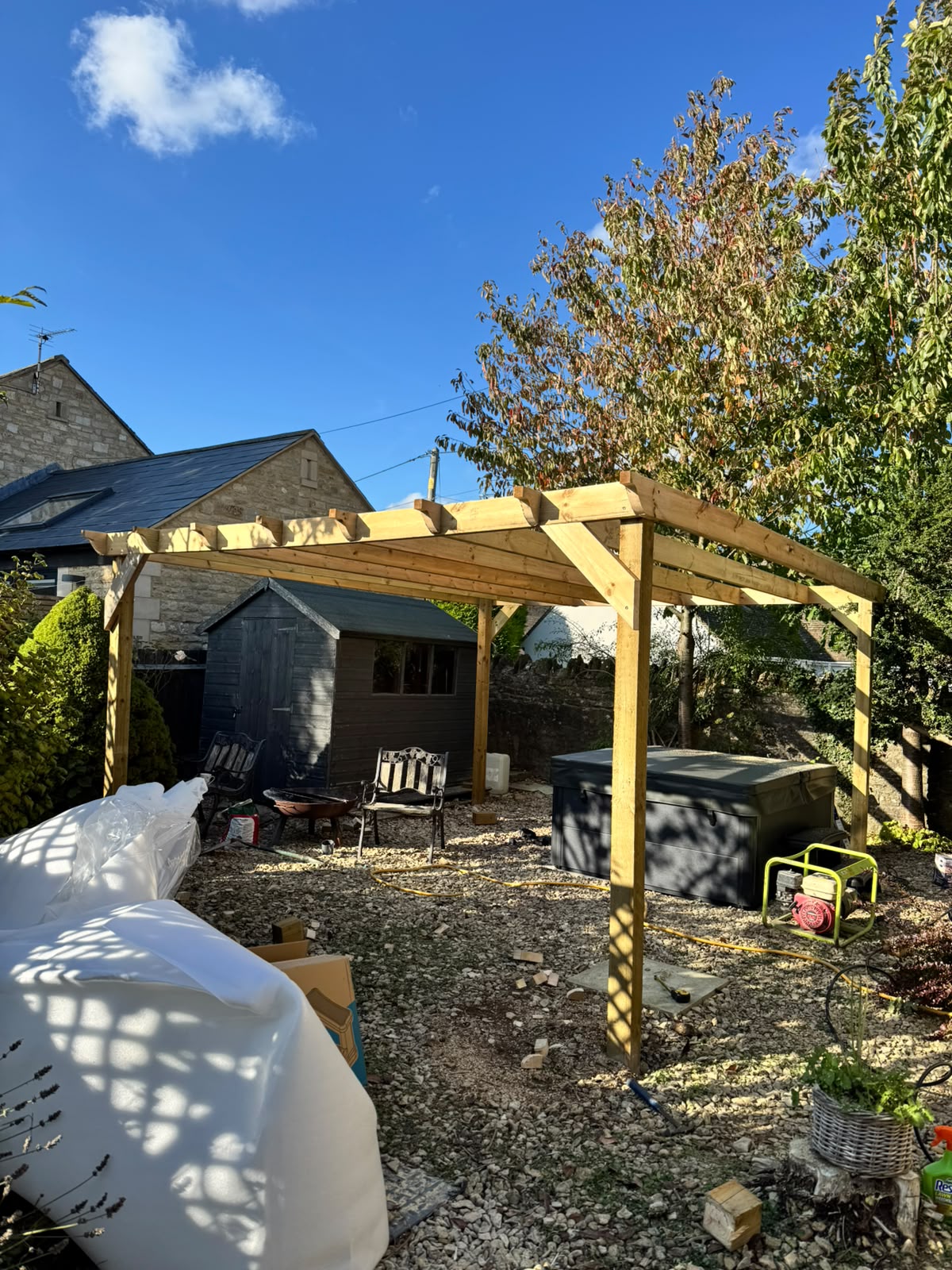 Finished pergola ready for a hot tub and garden seating