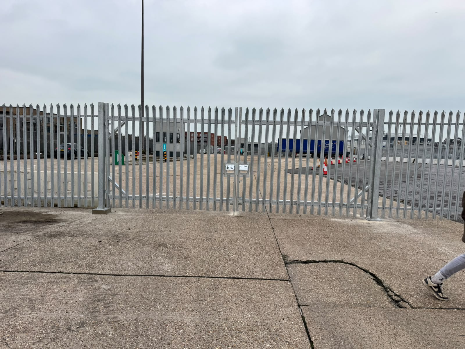 Palisade double gates giving vehicle access to a commercial yard